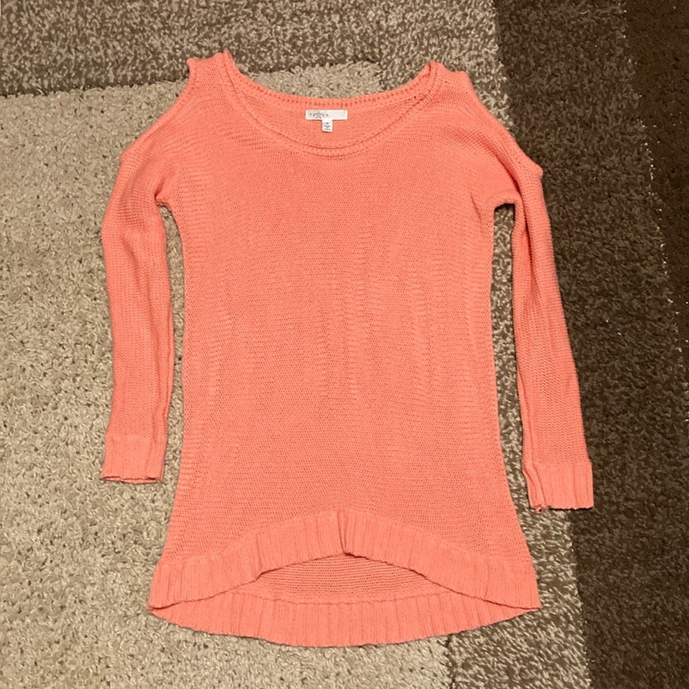 Fever pink knit cold shoulder sweater with a high low hem.